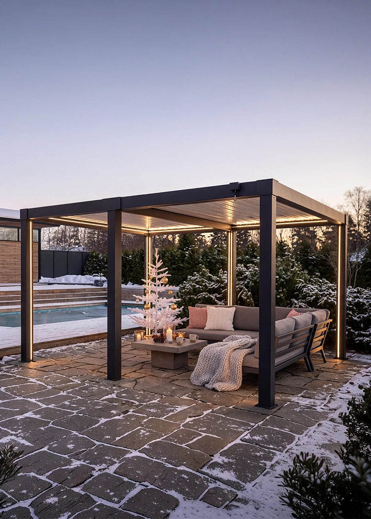 Outdoor patio with pergola, sofa, and Christmas tree in a snowy garden setting.