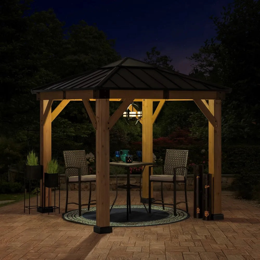 Wooden gazebo with outdoor furniture under a dark sky