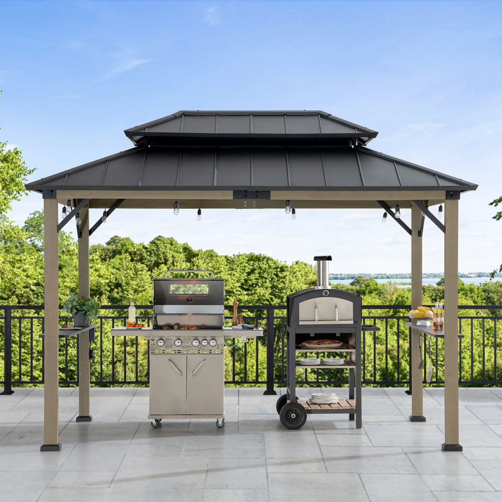 Outdoor gazebo with grills and a pizza oven on a patio